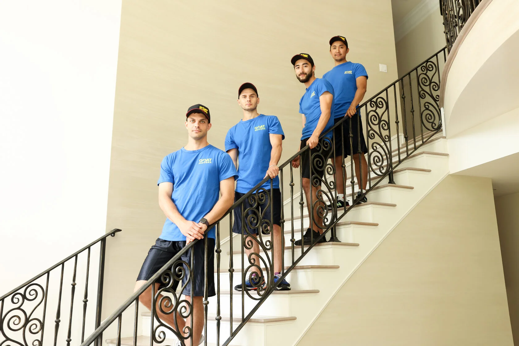 GOAT Movers team on stairs